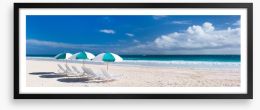 Beach and umbrellas panorama Framed Art Print 60962605