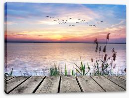 Across the sunset lake Stretched Canvas 62496449