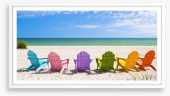 Rainbow chairs on a sunny beach Framed Art Print 65357803